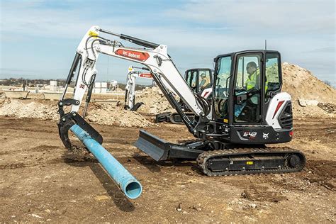 using a bobcat mini excavator on hills|mini excavators working videos.